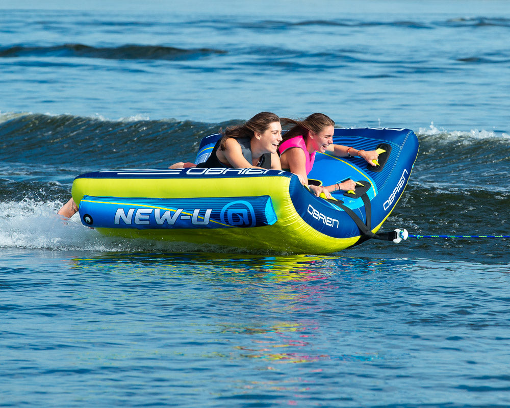 Smiling pair thrills on the water with the OBrien New-U 2 Towable Tube.
