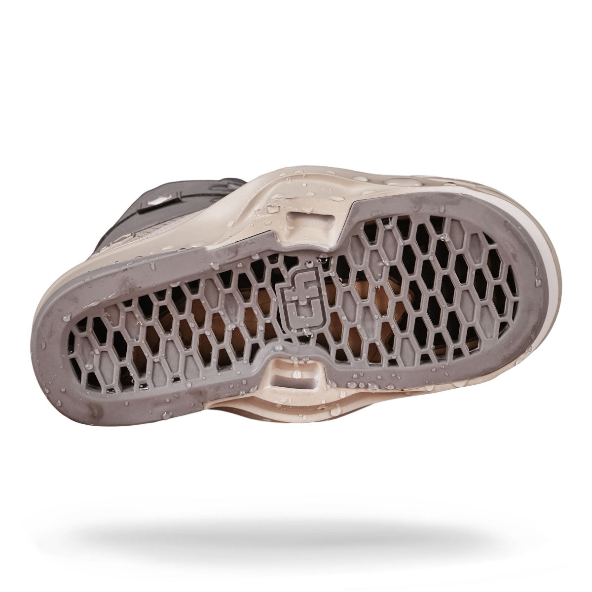 The image showcases the sole of a wakeboard binding highlighting its honeycomb base against a white backdrop.