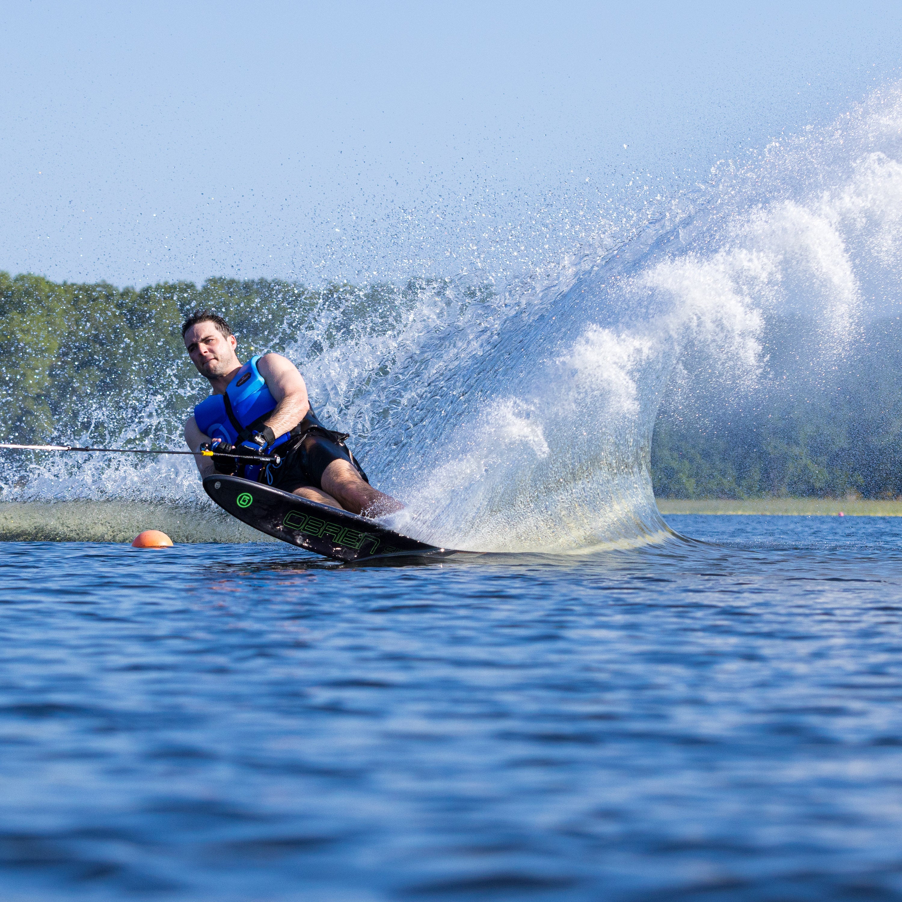 Close-up of the O'Brien Siege Slalom Waterski in action, displaying the ski's responsiveness.