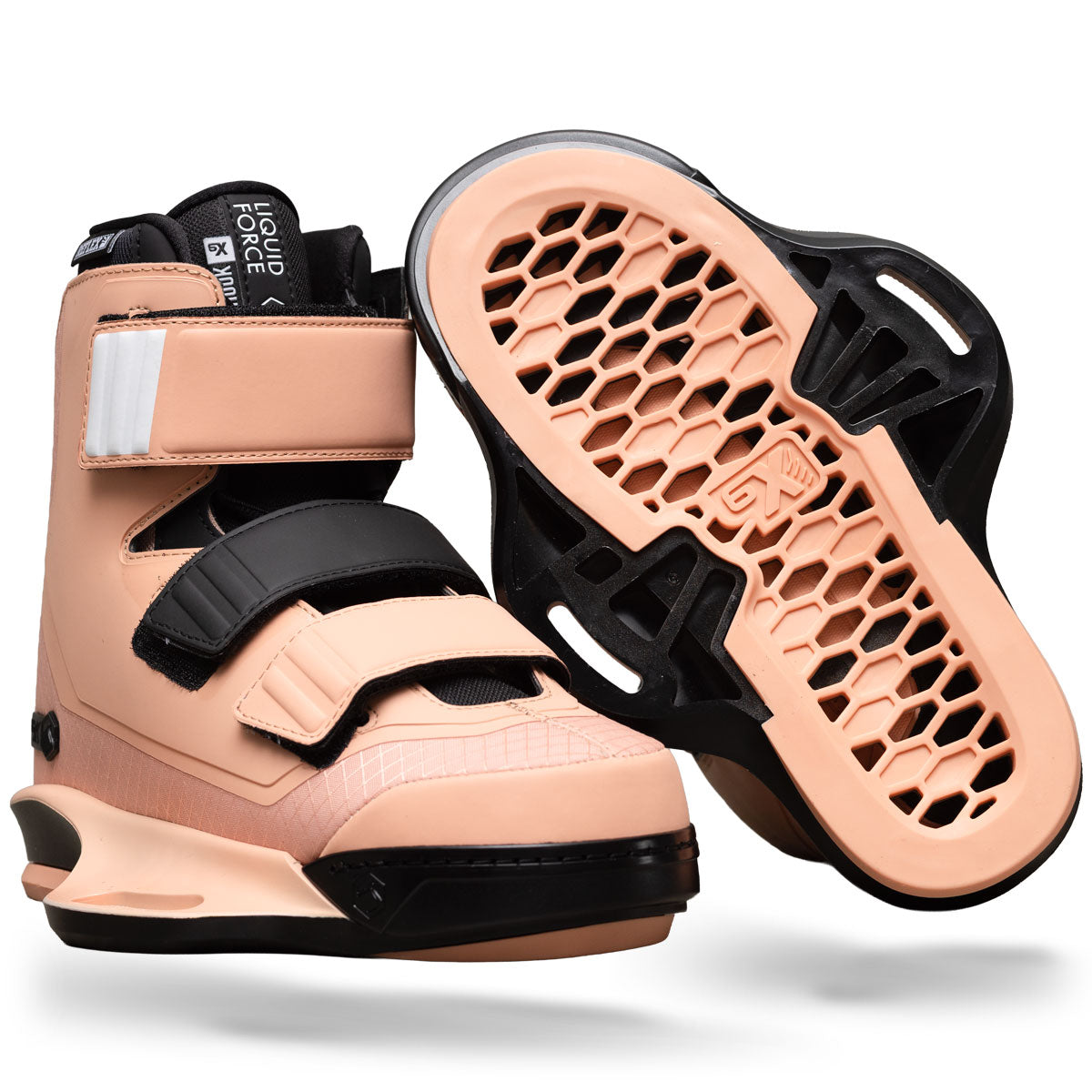 Angled view of Hook 6X binding in coral with black straps and matching sole.