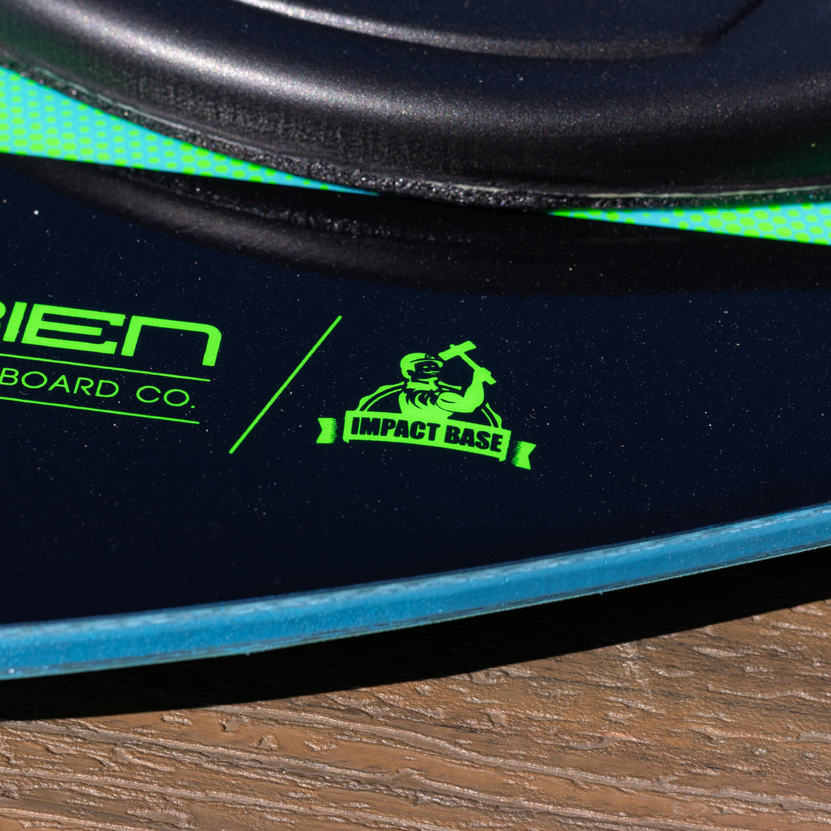 Green “Impact Base” logo printed on the black deck of the O'Brien Enforcer Kneeboard.