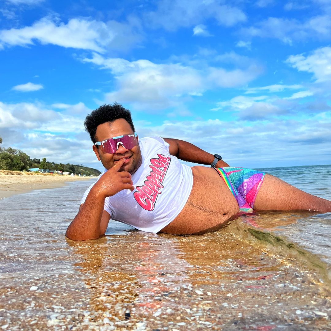 Narrow / Polarized Pink | orange.JPG | Person laying on beach wearing The Gobby Original from Pit Viper Sunglasses