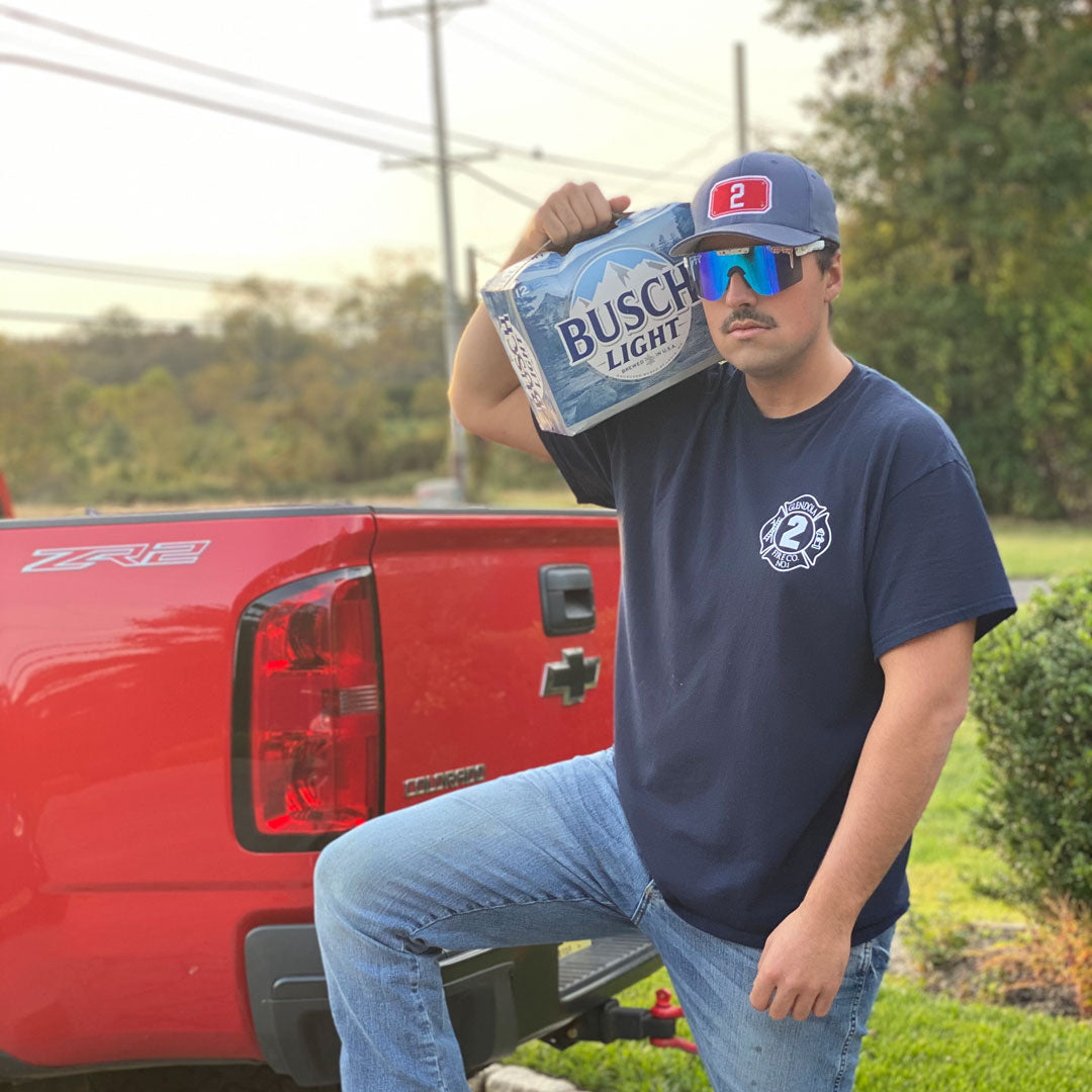 Narrow / Polarized Blue | thats_why_i_took_all_these_photos.JPG | Man holding a 12 pack of beer on his shoulders wearing The Merika Original from Pit Viper Sunglasses
