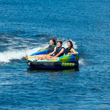 Three people towing on the OBrien Baller 3 Boat Tube, smiling in life jackets.