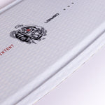 Close-up of O'Brien Intent Wakeboard’s textured white deck featuring a black tribal-style logo and "INTENT" text.