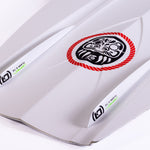 O'Brien Intent Wakeboard close-up of inset fins and channeling on the white base with black detailing.
