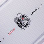 Angled close-up of O'Brien Intent Wakeboard’s black tribal-style logo with intricate red detailing.