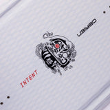 Angled close-up of O'Brien Intent Wakeboard’s black tribal-style logo with intricate red detailing.