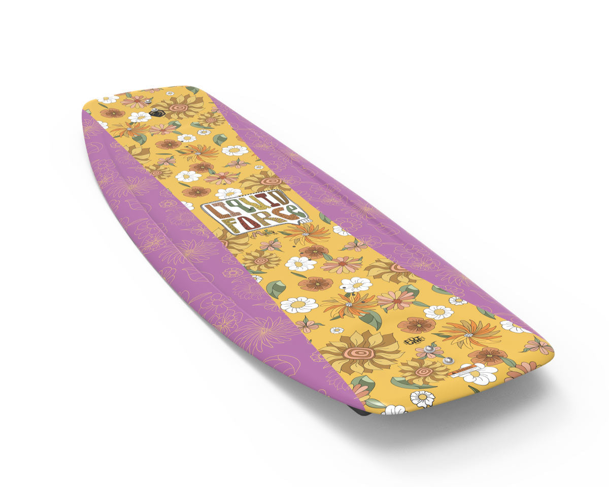Wakeboard angled top view that has a floral design with yellow, pink, and white flowers and a centered logo.