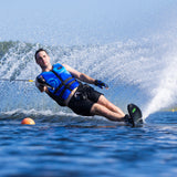 Action shot of a skier on the O'Brien Siege Slalom Waterski, carving through the water with a large spray.