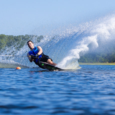 Wide shot of a skier using the O'Brien Siege Slalom Waterski, cutting through a slalom course.