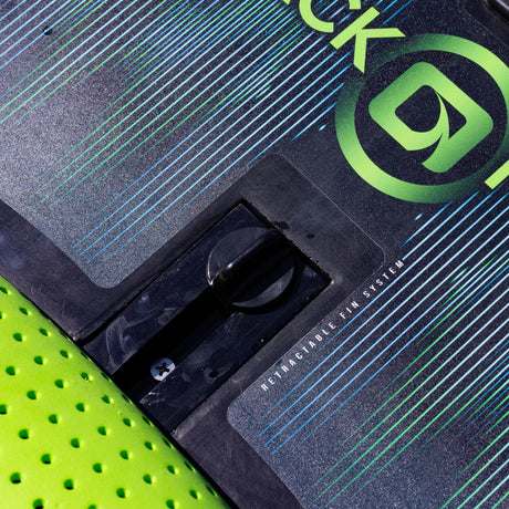 Close-up of the retractable fin system on the O'Brien Black Magic Kneeboard deck.