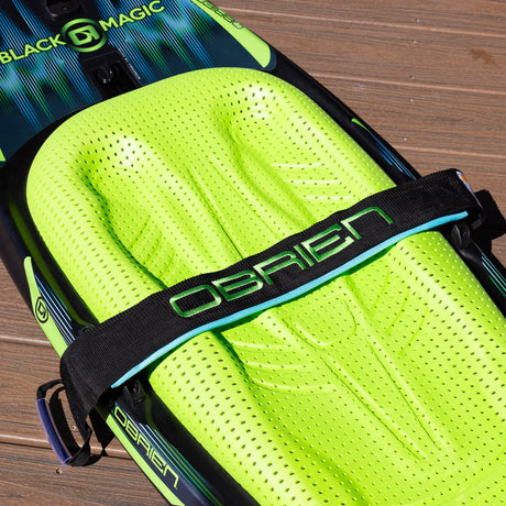 Detail of O'Brien Black Magic Kneeboard strap over bright green textured knee pad.