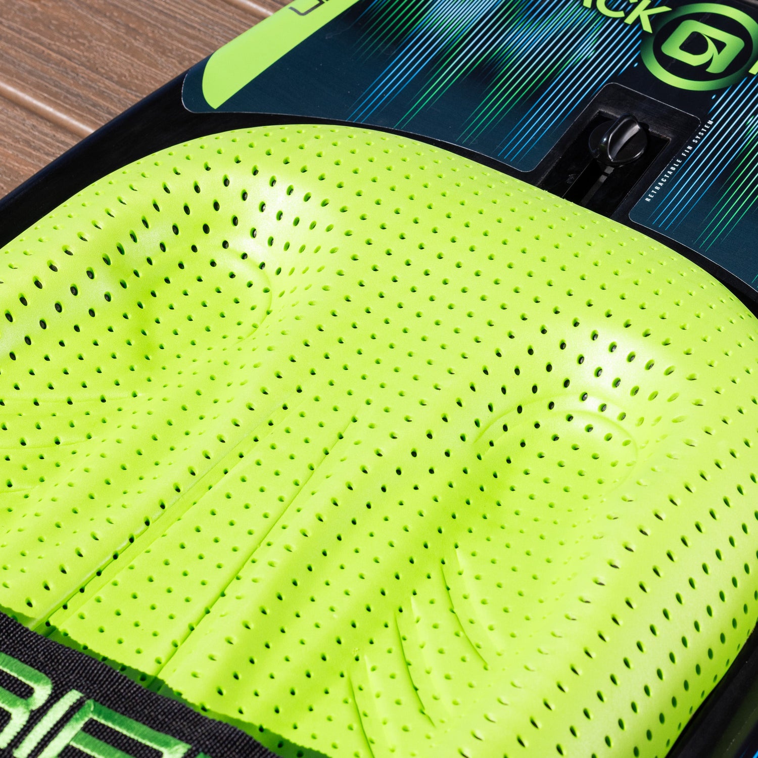 Close-up of the bright green padded knee area on the O'Brien Black Magic Kneeboard.