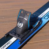 Close-up of a ski binding on a ski with 'O'Brien' branding on a wooden surface.