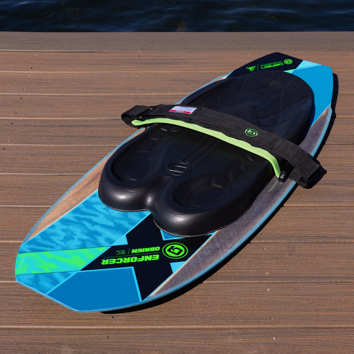 Top view of the O'Brien Enforcer Kneeboard showing black pad, green strap, and blue graphics.