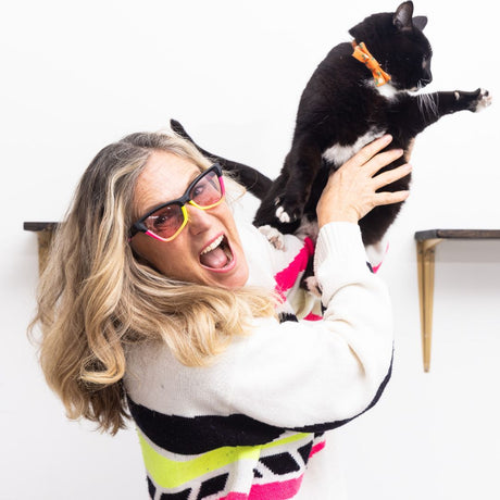 Photochromic Rose | you_want_to_buy_this.JPG | Womens holds cat while wearing The Italo Clawdia with a photochromic rose lens from Pit Viper