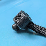 Set of ten black push clips with a locking mechanism, used for wakeboard binding adjustments.