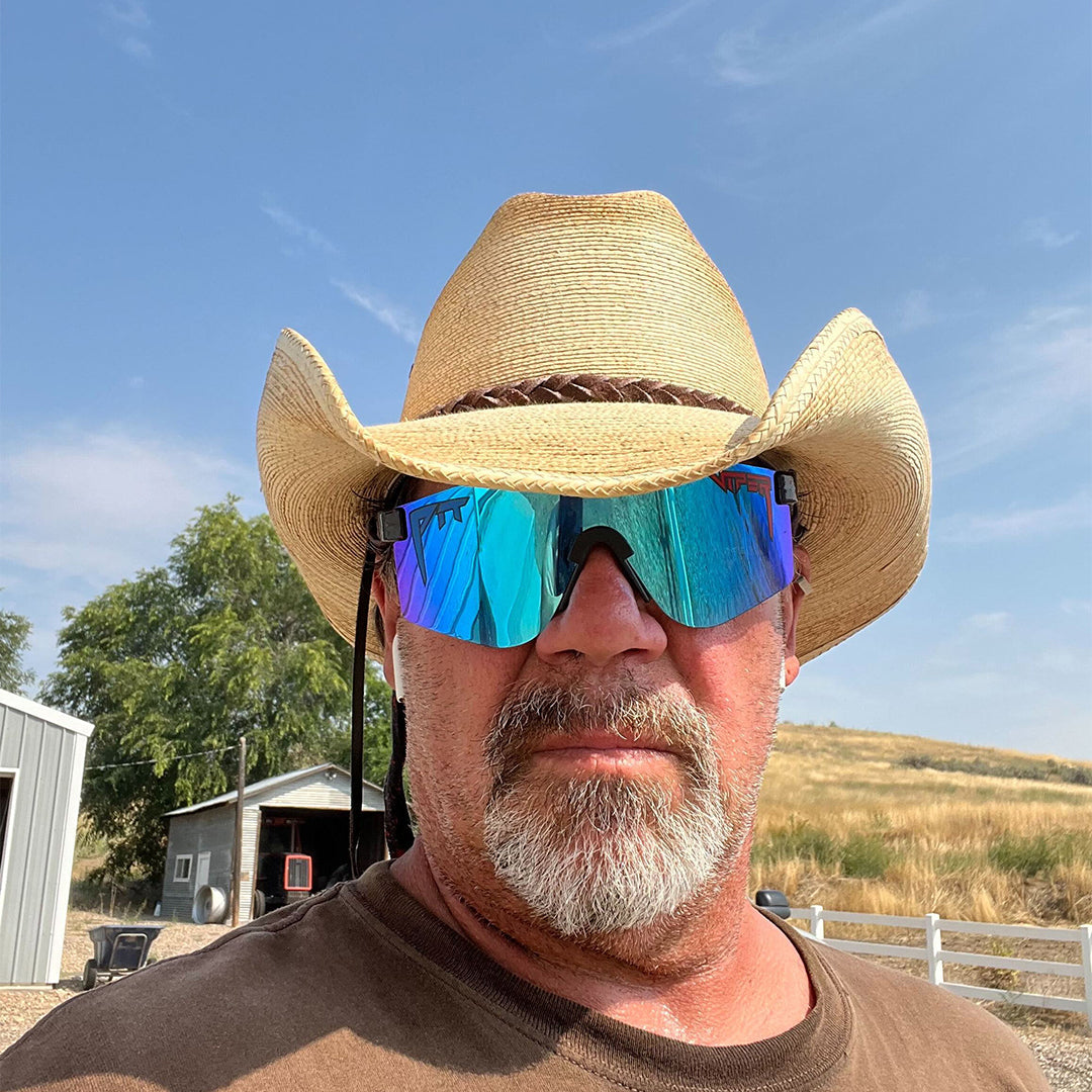 Wide / Polarized Blue | orange_you_glad_you_dont_have_to_name_420_image_files.JPG | Man wearing a cowboy hat and The Peacekeeper Original from Pit Viper Sunglasses