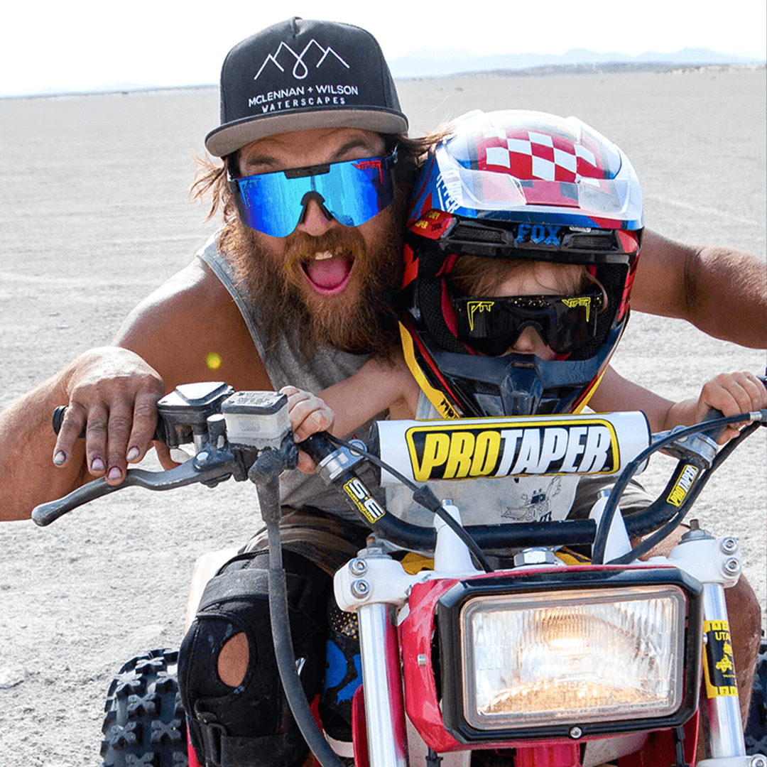 Wide / Polarized Blue | whos_there.JPG | Man and kid on an ATV wearing The Peacekeeper Original from Pit Viper Sunglasses