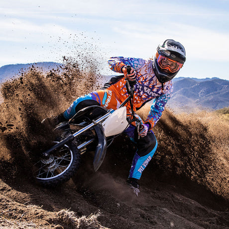 / Clear | Man on a dirtbike wearing The Terremoto Brapstrap by Pit Viper Sunglasses