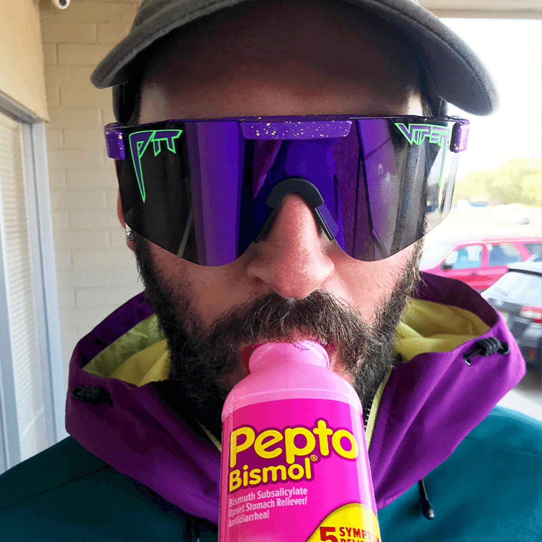 Wide / Polarized Purple | corn_dog.JPG | Man drinking pepto bismol wearing The Donatello Original from Pit Viper Sunglasses