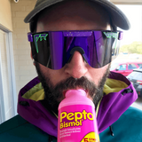 Wide / Polarized Purple | corn_dog.JPG | Man drinking pepto bismol wearing The Donatello Original from Pit Viper Sunglasses