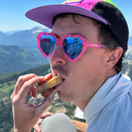  | to_organize_image_files.JPG | Man eating wearing The Dragonfruit Jellies Admirer from Pit Viper Sunglasses