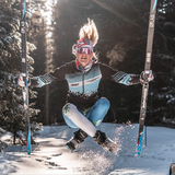Narrow / Polarized Pink | orange_you_glad_you_dont_have_to_name_420_image_files.JPG | Woman jumping with skis wearing The Gobby Original from Pit Viper Sunglasses
