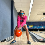Narrow / Polarized Blue | AHHHHHHH.JPG | Woman bowling wearing The Leisurecraft Original from Pit Viper Sunglasses
