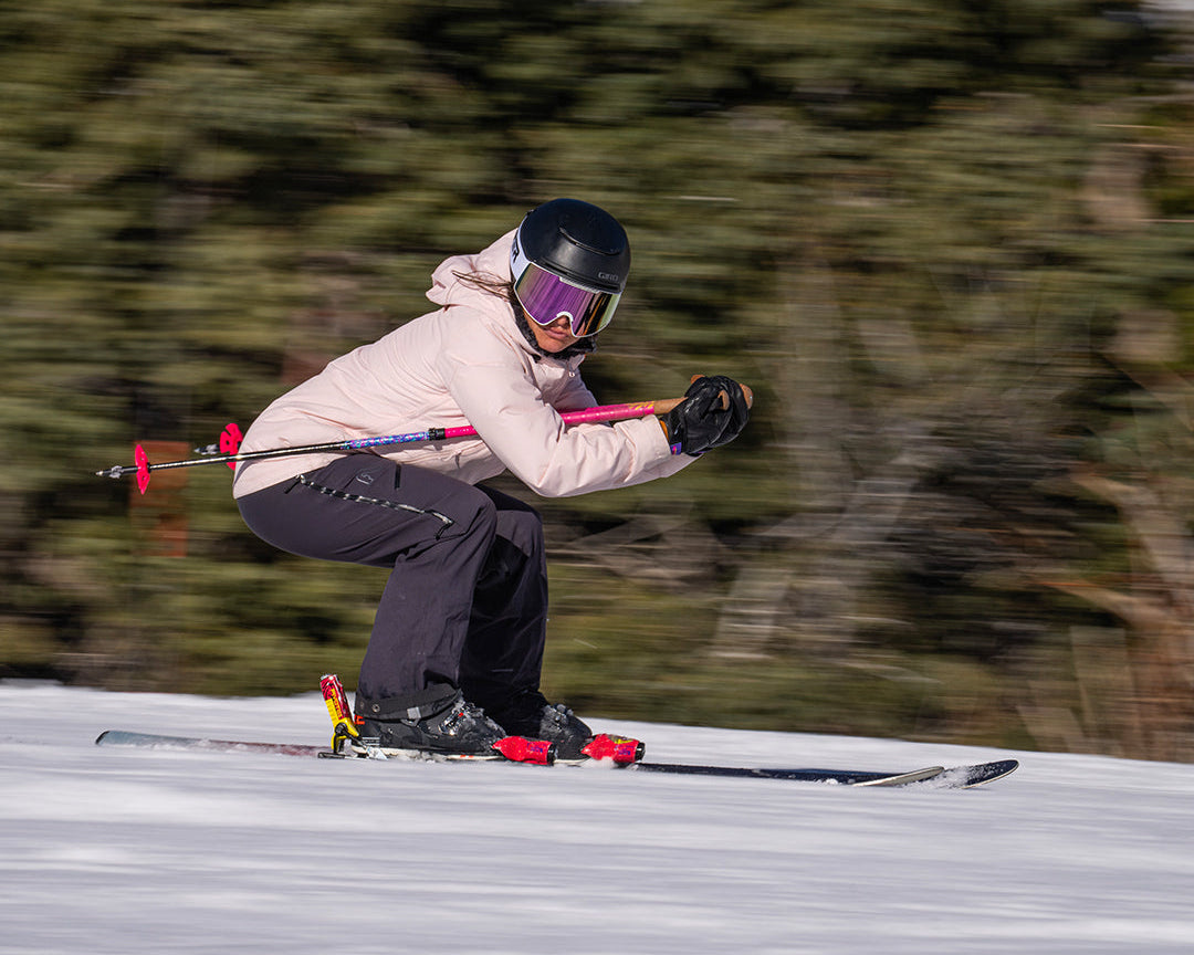 / Pink | Woman skiing wearing the Miami Nights Proform Goggle by Pit Viper Sunglasses