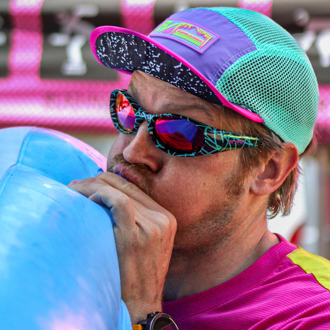  | AHHHHHHHHHHH.JPG | Man blowing up a pool toy wearing The Voltage Slammer from Pit Viper Sunglasses